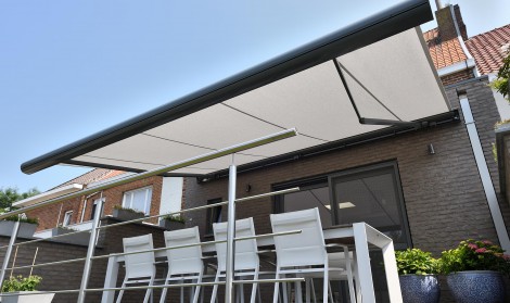Brustor Garden patio awning shown with table and chairs