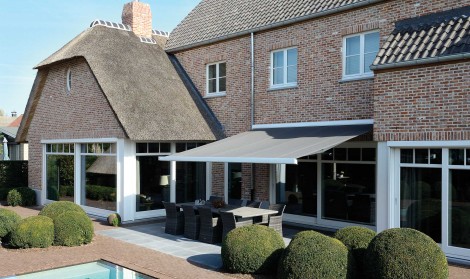 Brustor Awning installed over a swimming pool terrace